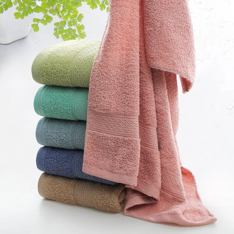 Thickened cotton blend bath and beach towel showing colour options including green, blue and brown variations