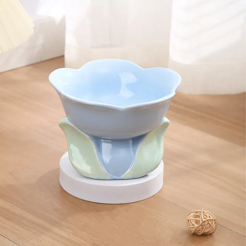 Blue ceramic pet bowl with floral pattern and elevated design for cats and small dogs