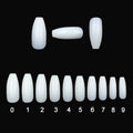 500 clear natural acrylic false nails in various sizes on a white background.