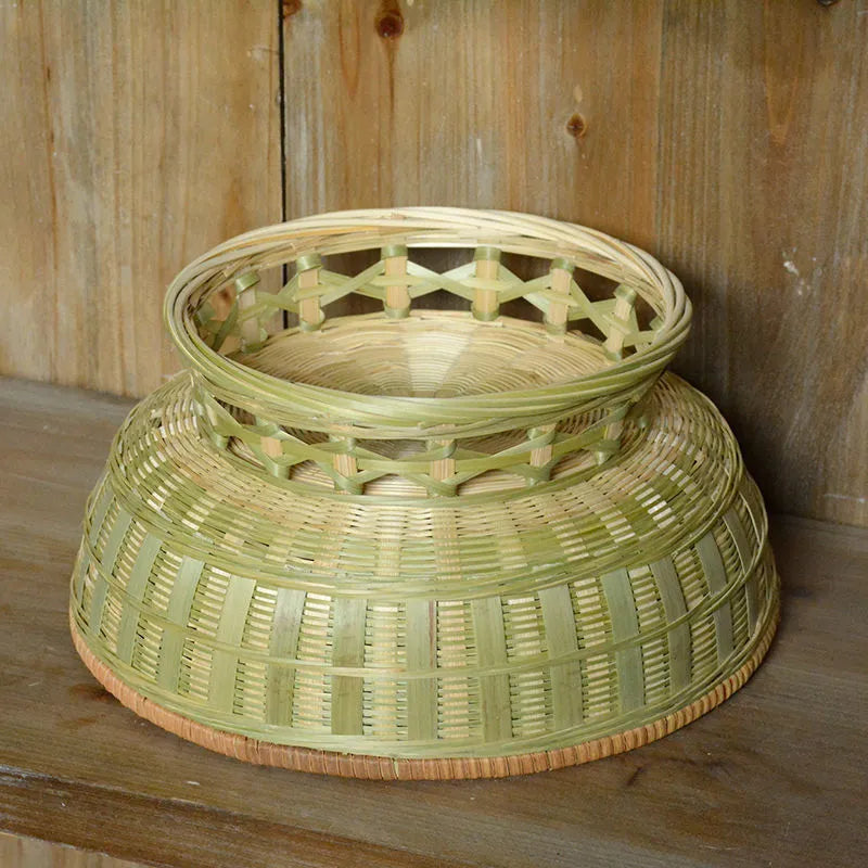 Handmade natural bamboo storage basket showing woven texture in three available sizes
