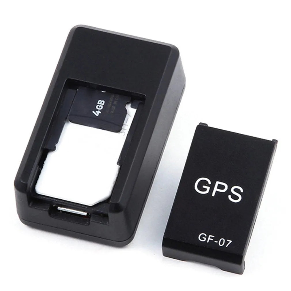 Small black magnetic GPS tracker device with USB cable for real-time vehicle and asset location tracking.