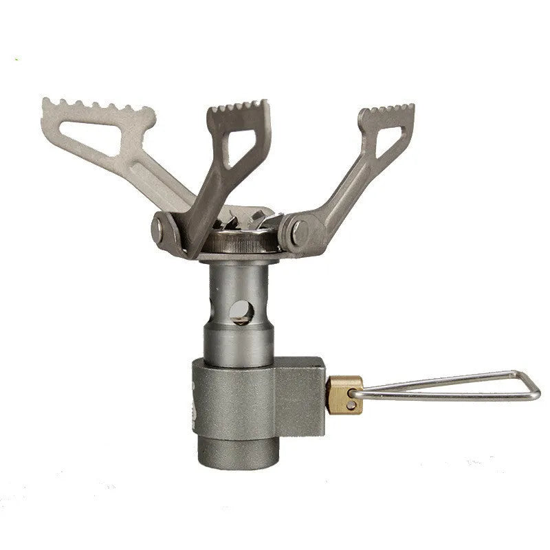Compact portable camping stove with one-piece steel body and folded legs, shown with a propane canister.