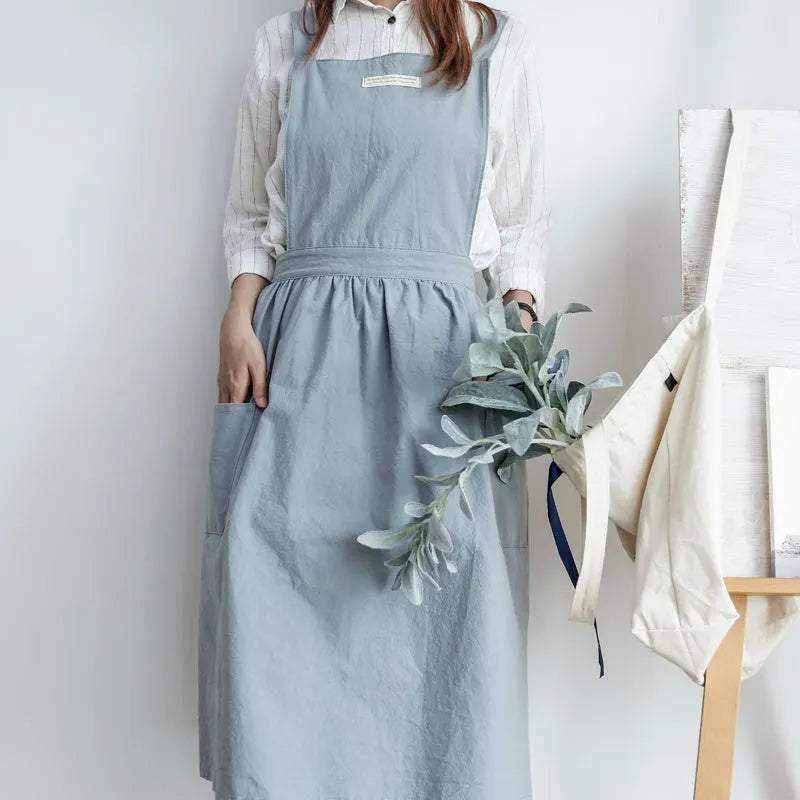 Cotton plain sleeveless kitchen apron in blue colour on white background