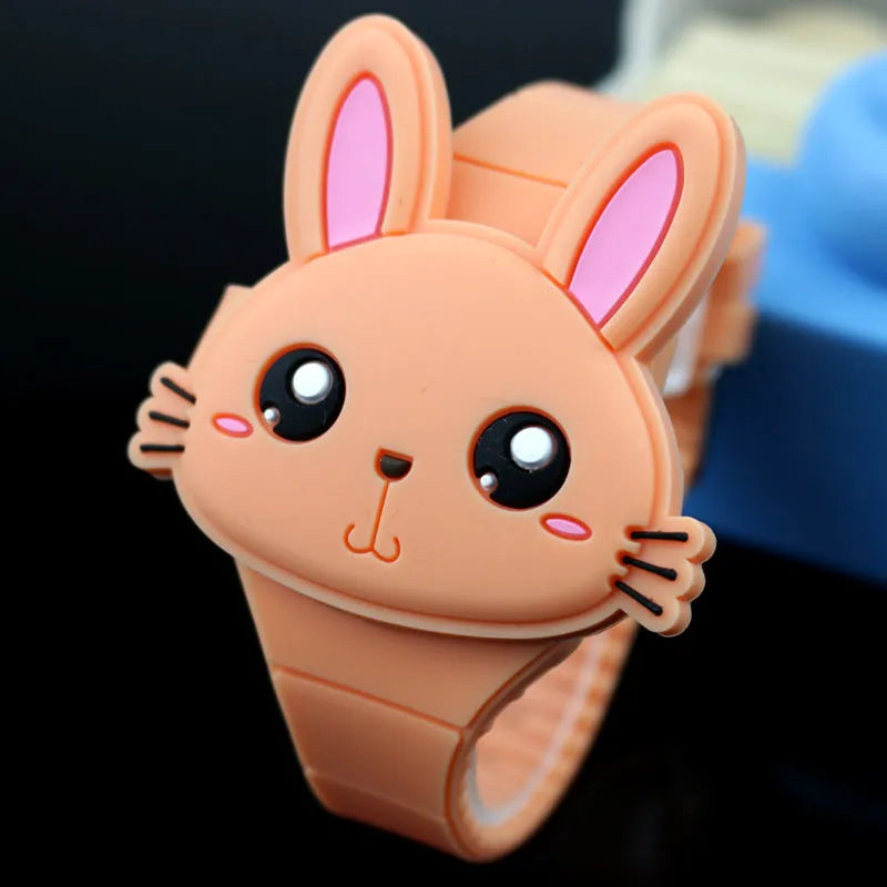 Children's electronic watch with 55mm plastic dial and silicone strap on a child's wrist