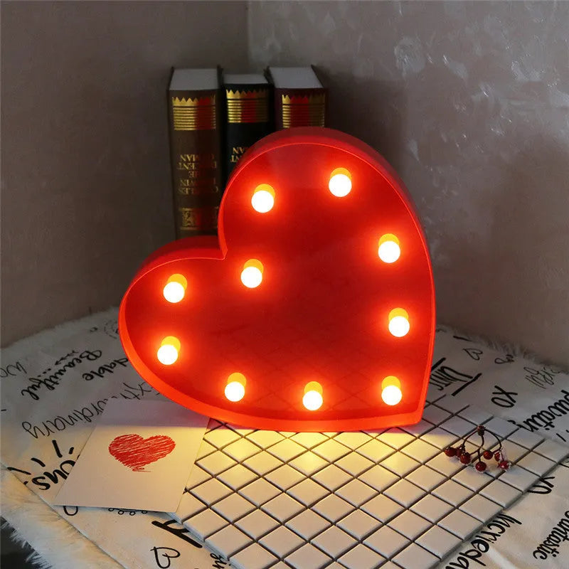 3D love heart marquee letter lamp in pink or red, 26.5cm x 4.0cm x 27.5cm, warm white LEDs, indoor wall or freestanding decoration