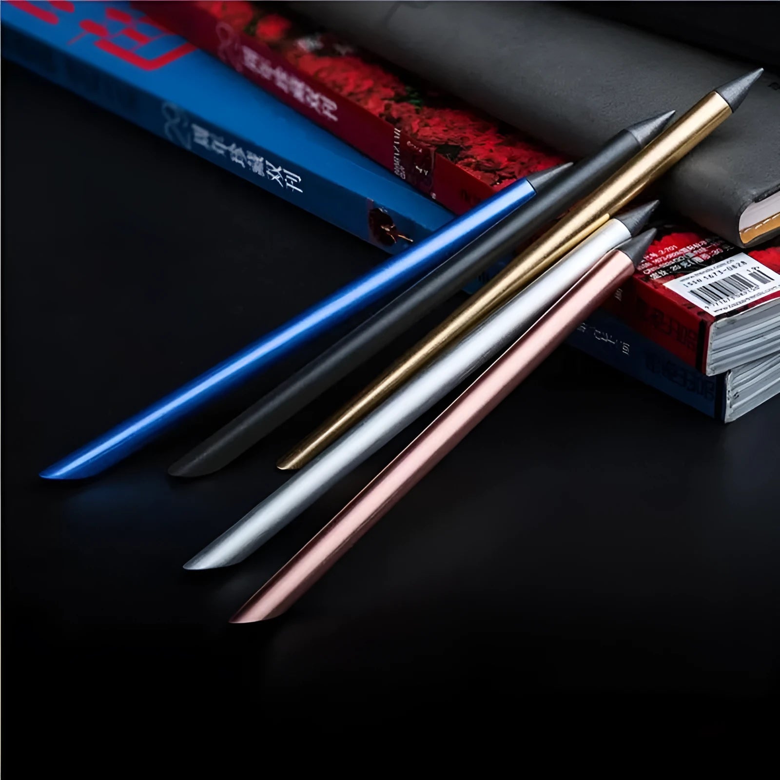 Silver Inkless Metal Pen with 0.5mm alloy nib, spare nib, and pen bag on presentation box.