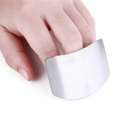Stainless steel finger guard in single and double finger sizes on a kitchen chopping board