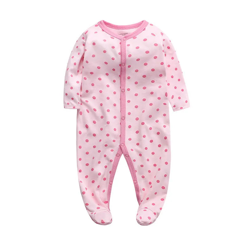 Soft cotton baby one-piece bodysuit in blue and green dinosaur print, size 6M, front view on white background