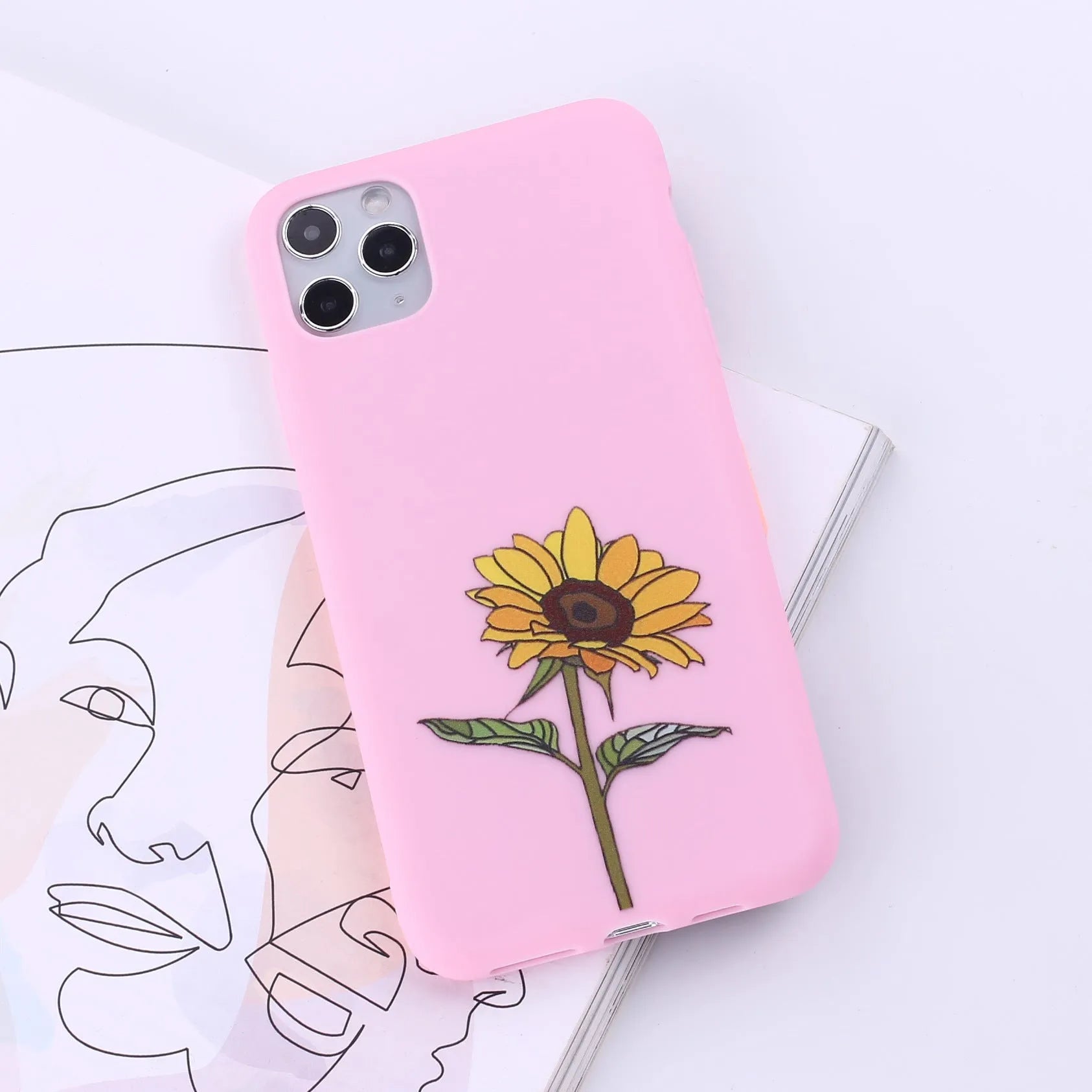 Assorted coloured TPU back cover cases for various iPhone models on a white background.