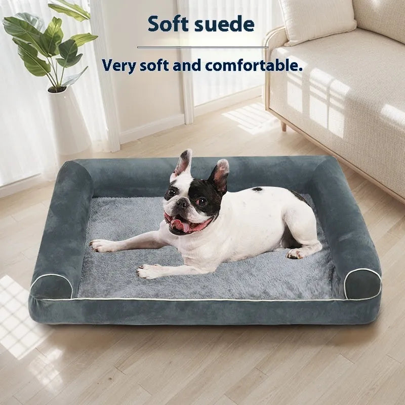 A square grey dog bed with a raised sponge can border on a wooden floor.