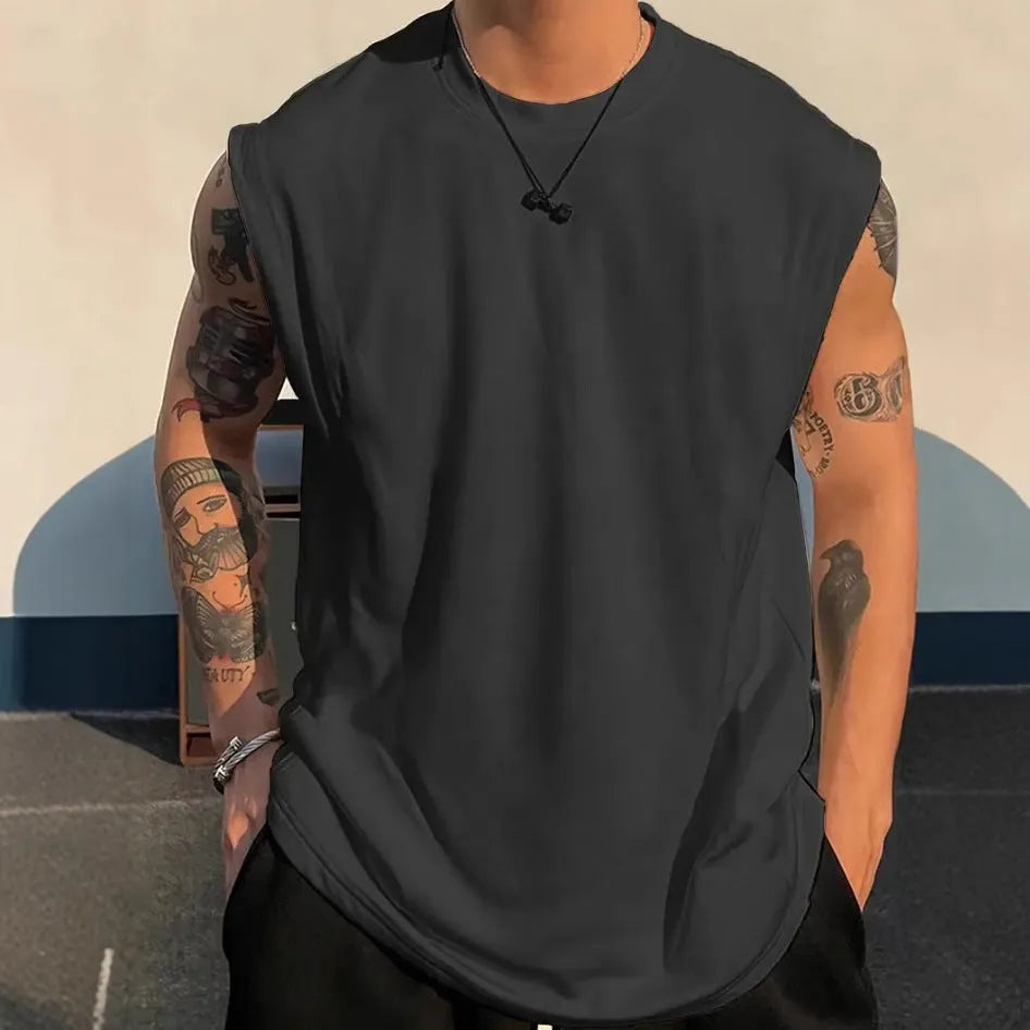 Men's loose sleeveless cotton t-shirt in a solid colour on a hanger.
