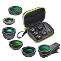 Black 6-in-1 smartphone lens kit with fisheye, macro, telephoto, CPL, and star filters next to a phone on a table.