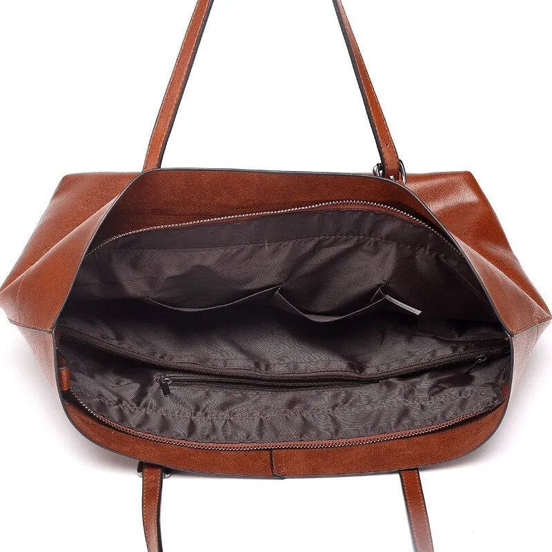 Brown waxed cowhide leather crossbody handbag showing front view with two compartments.