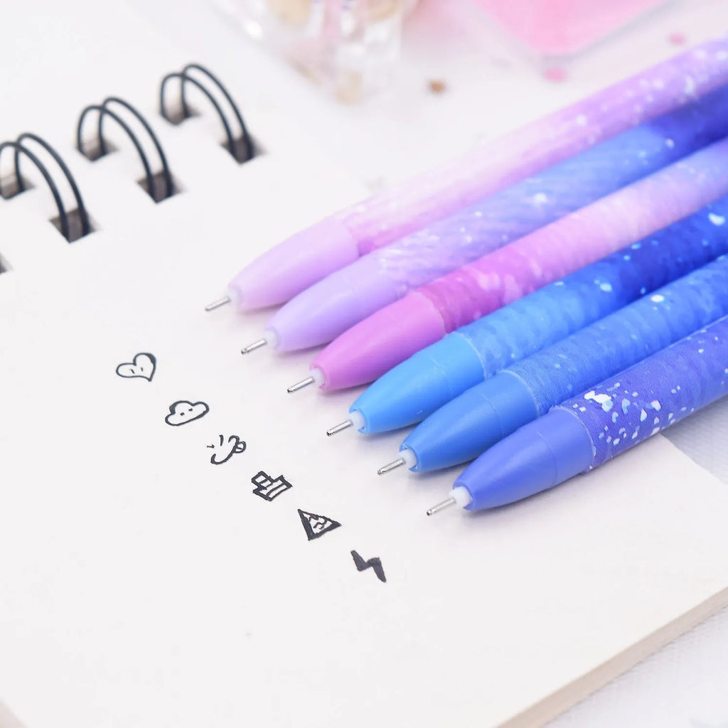 Box of 12 constellation-themed quick-drying gel pens with plastic bodies and coloured caps