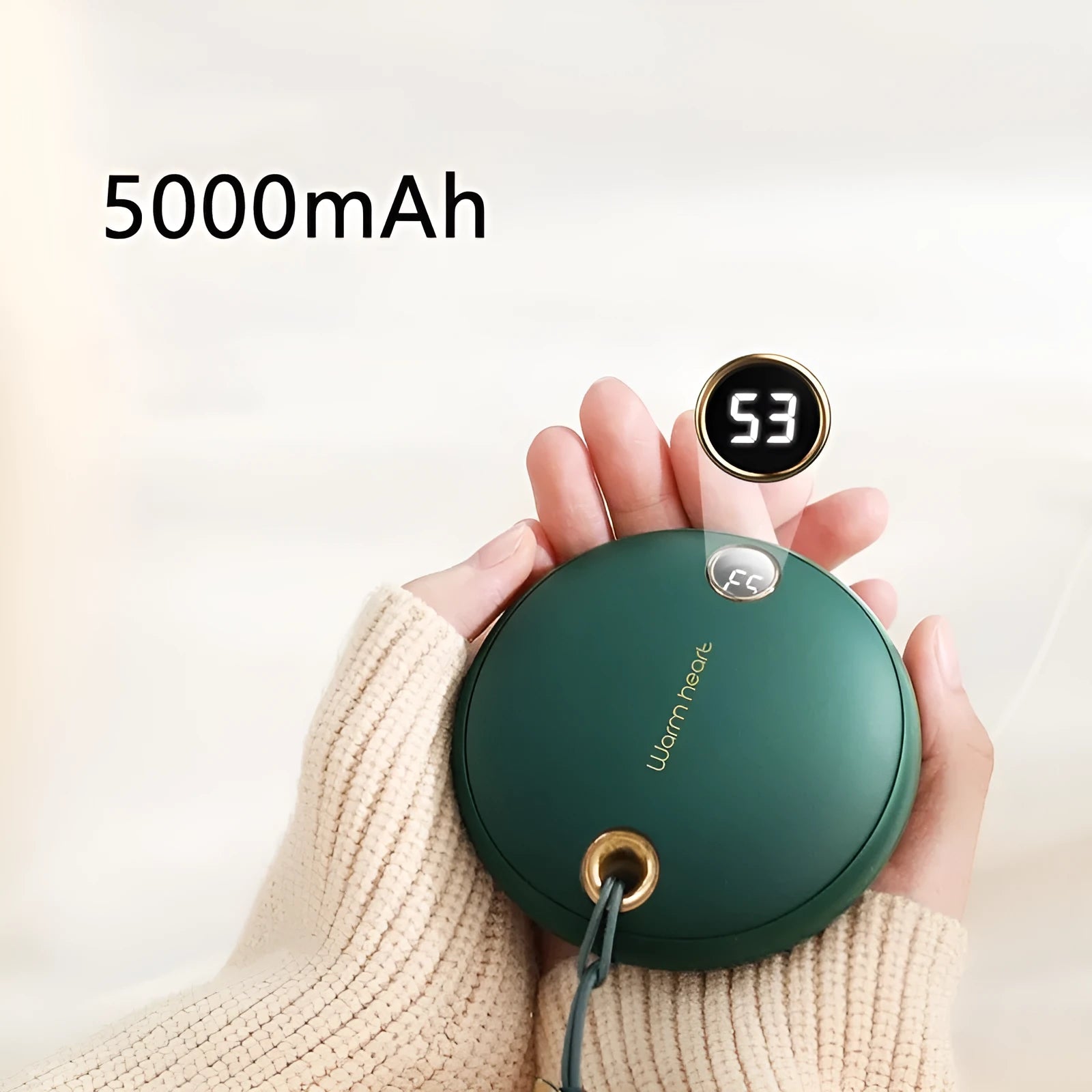 Green hand warmer power bank with digital display showing battery level, next to a USB-C cable.