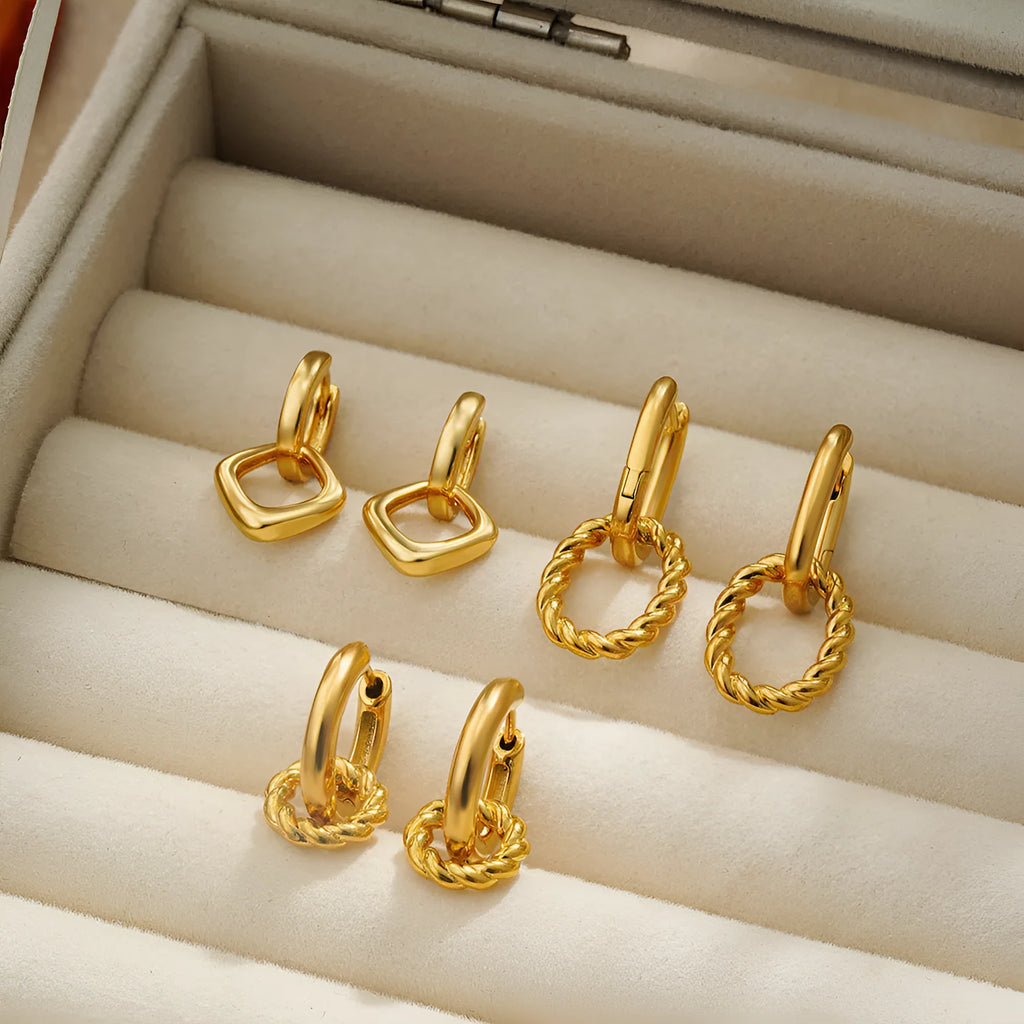 Copper geometric square double ring twist ear clip earrings on display