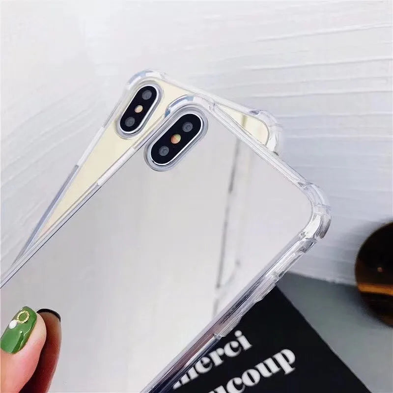 TPU mirror phone case for iPhone on a table, showing anti-fingerprint finish.