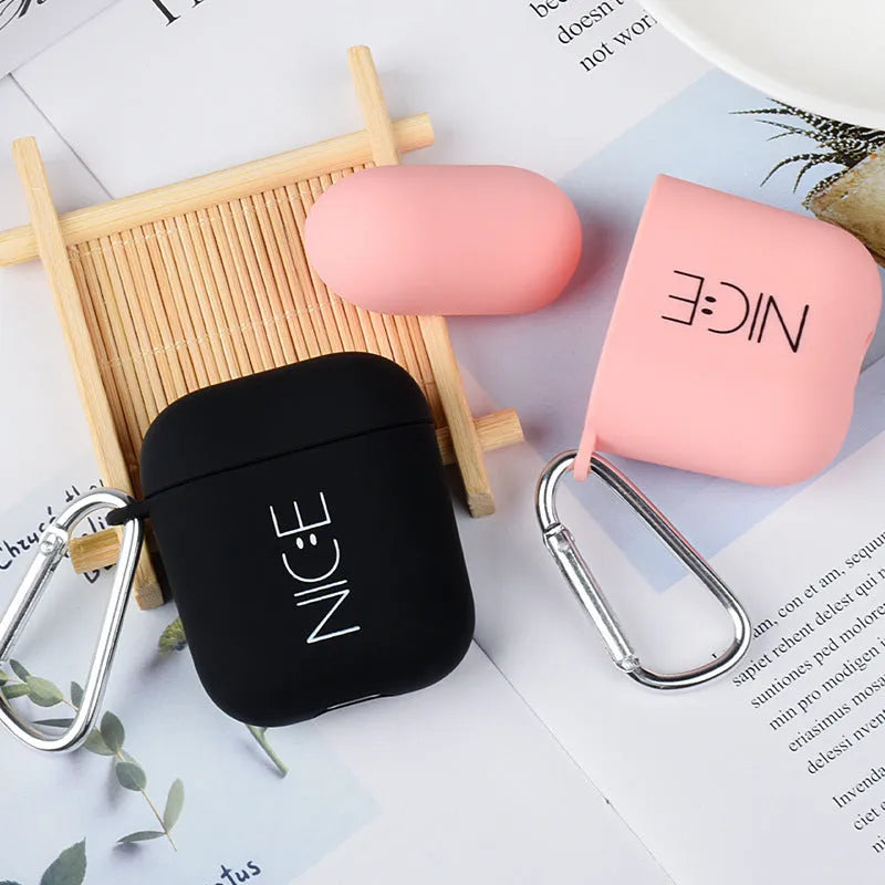 Polycarbonate AirPods case cover with floral and emoticon decorative designs in black and pink colour options
