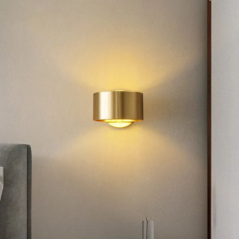 Modern wall lamp with a copper-colour finish, shown in black and gold options.