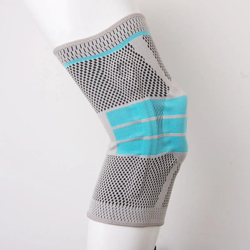 Sky blue silicone grip knee pad for sports, shown in elastic fibre material.