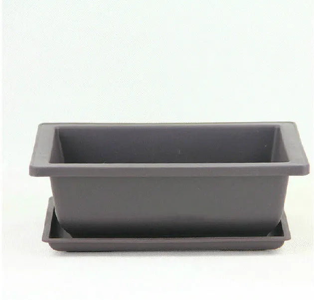 Dark brown antique-style recycled plastic plant pot, shown in a selection of sizes for desktop or floor use.