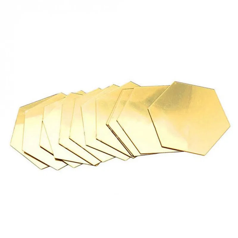 Hexagonal silver PS mirror wall sticker on a wall surface close up