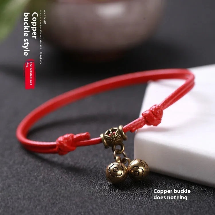 Nylon rope dog collar with brass bell shown in black, red, and coffee colour options on a plain background.