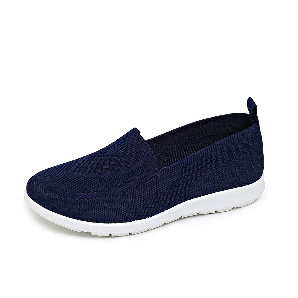Women's mesh trainers with low flat heel and PVC sole, shown in a solid colour casual style