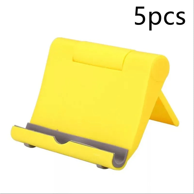 Black PE folding phone and tablet stand with soft rubber backing, shown at an adjustable angle.