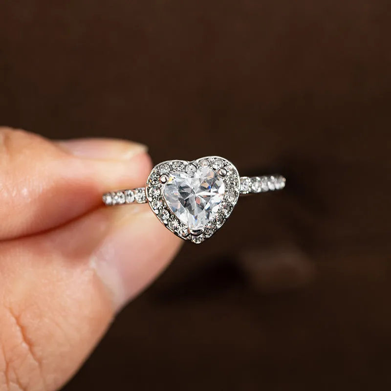 Women's heart-shaped wedding ring with crystal accents in rose gold or silvery finish