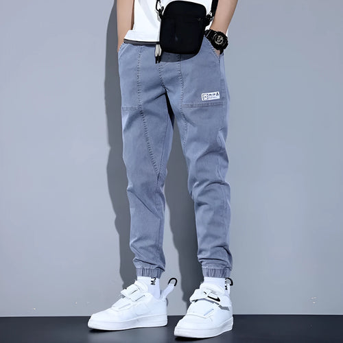 Two pairs of women's casual cotton jeans with mid waist and washed finish in grey and black