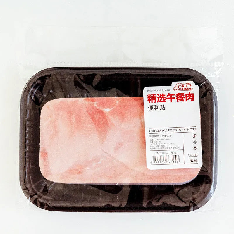 Post-it message notepad with food-themed cover design showing bacon, salmon or pork belly illustration
