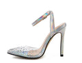 Women's pointed toe stiletto heel sandals with a glossy PVC upper and an ankle strap buckle.