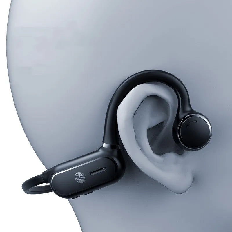 Black air conduction wireless earphone with titanium frame shown bent around a pair of glasses.