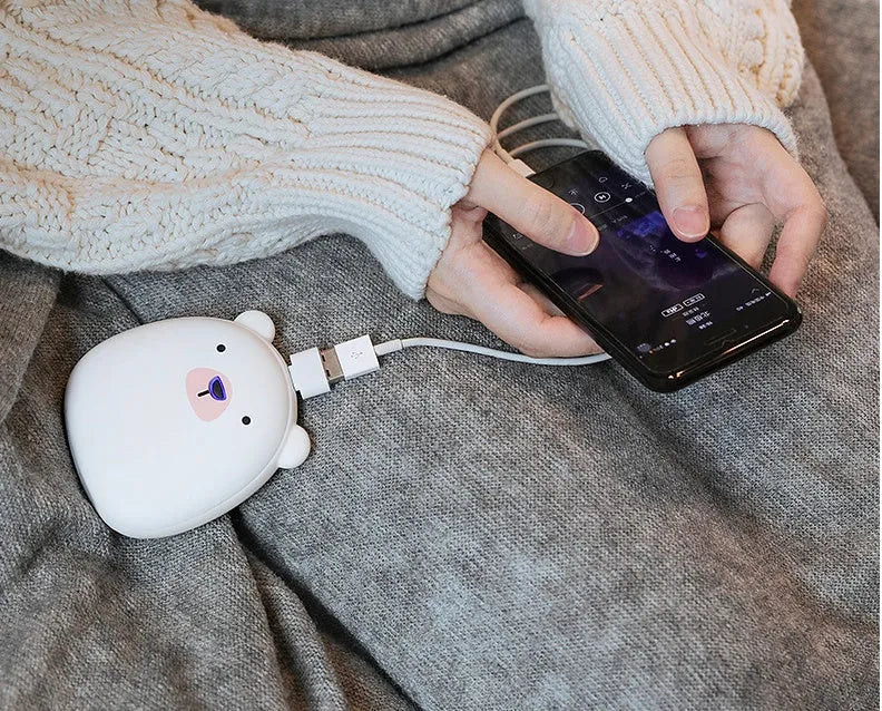 Cartoon penguin and polar bear USB rechargeable hand warmer and power bank showing double-side heating
