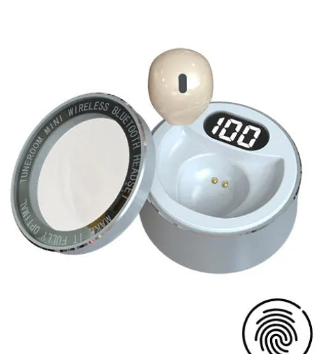 Miniature 9mm transparent Bluetooth earphone in skin tone, shown fitting discreetly in an ear.