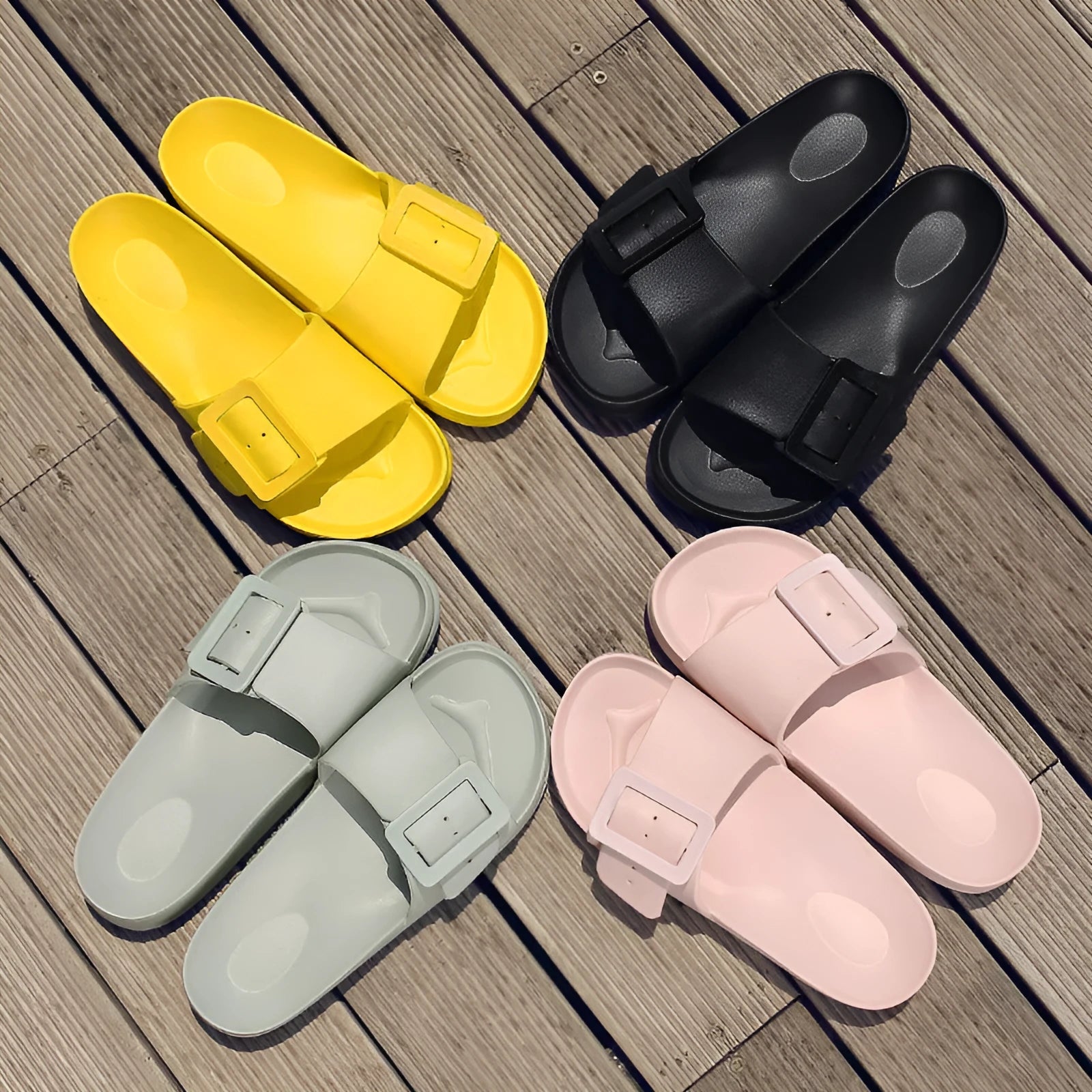 Women's grey blue EVA foam slippers with a buckle strap and soft sole.