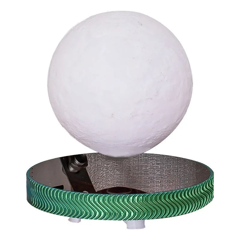 Modern magnetic levitation lamp with a 3D-printed spherical moon ornament floating above its base.