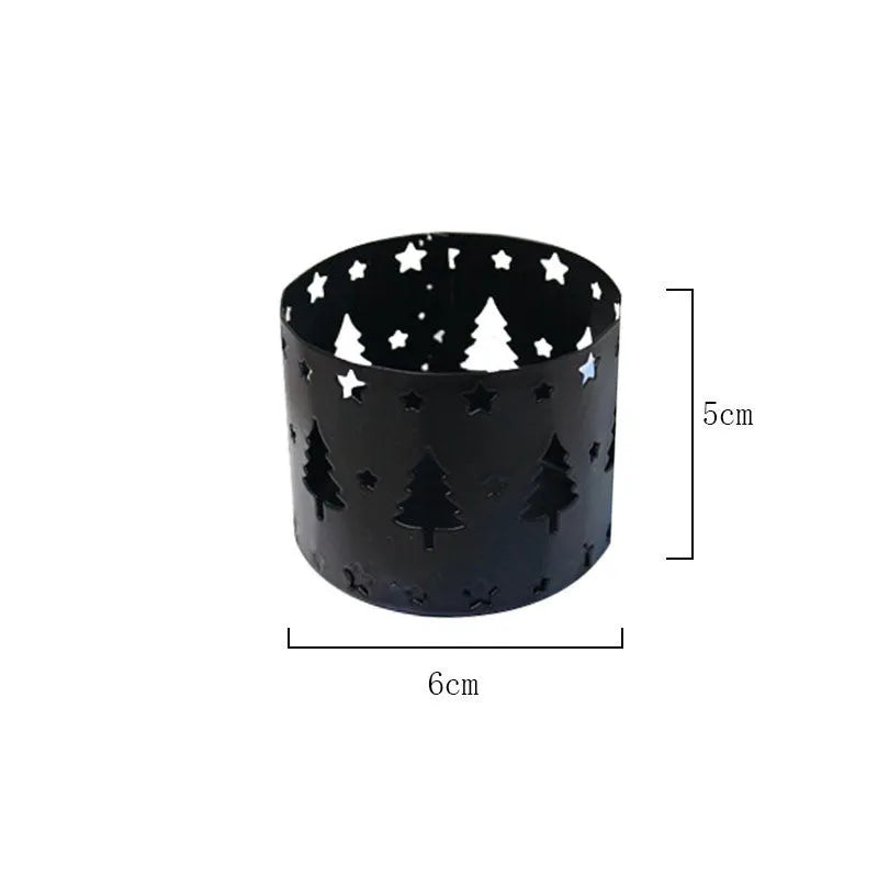 Black iron Christmas candlestick holder with decorative elk bracket design.
