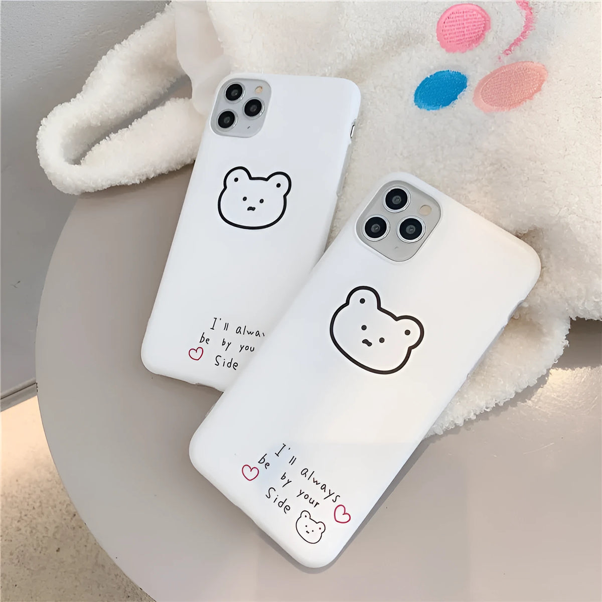 Silicone iPhone case with Korean bear cartoon design showing back and side coverage