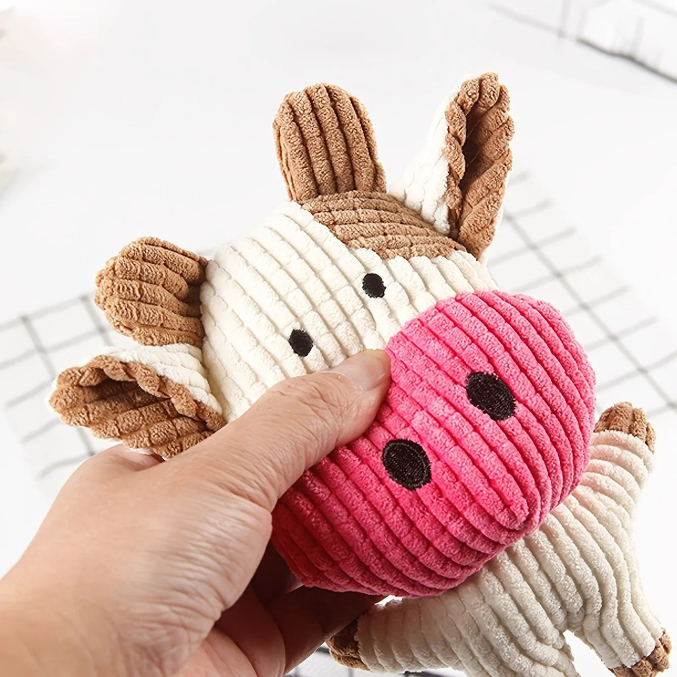 Animal shape plush squeaky dog toys in bright colours with bite-resistant construction