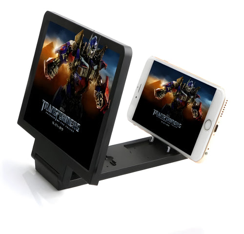 Black and white 3D mobile phone screen amplifier acting as a phone stand on a table