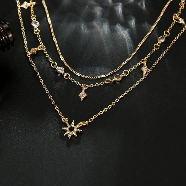 Handmade alloy multi-layer star pendant necklace in gold colour with layered chains and star pendants