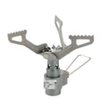 Compact portable camping stove with one-piece steel body and folded legs, shown with a propane canister.
