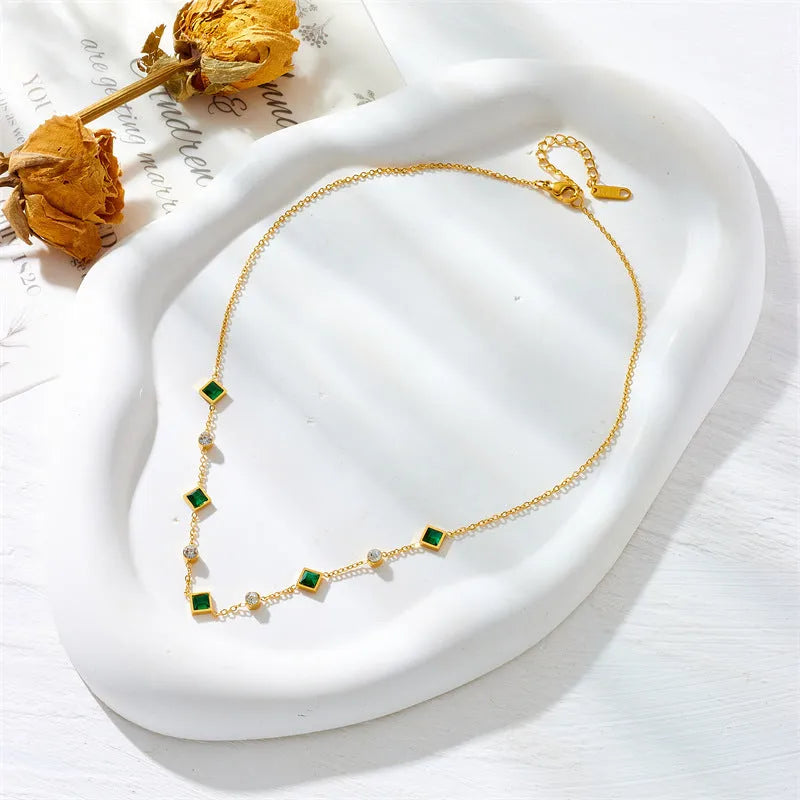 Gold titanium steel necklace with U-shaped pendant, square emerald zircon, and cross chain, 41-50cm.