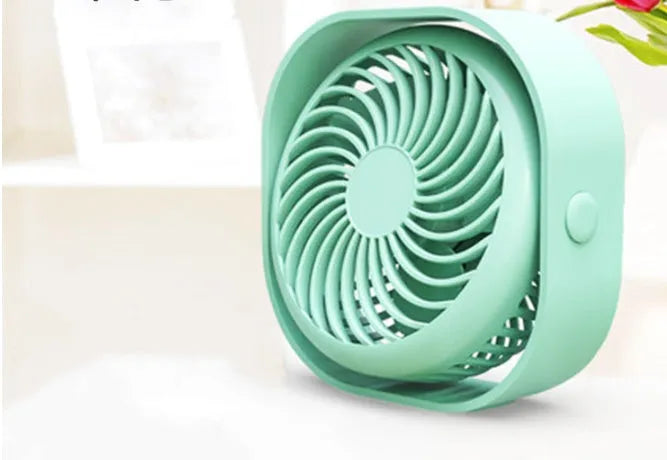 USB desk fan with alarm clock display in blue, showing rotating head on a modern base.