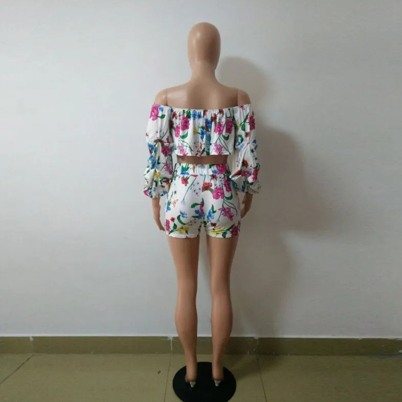 Women's multicolour digital print lounge set with puff-sleeved top and shorts.