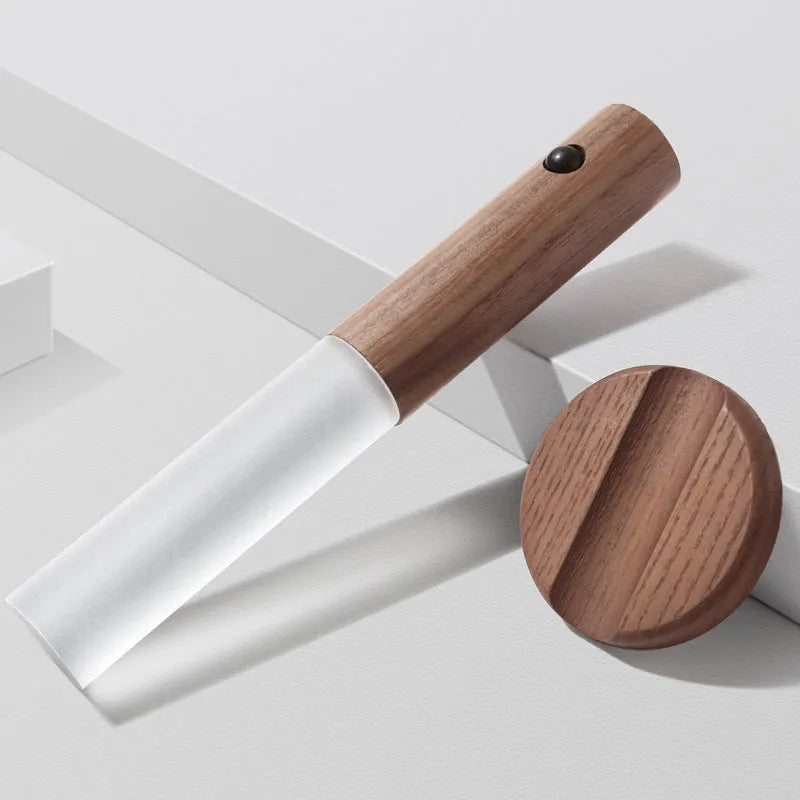 Wooden smart sensor LED desk lamp on a desk, showing compact size and simple design.
