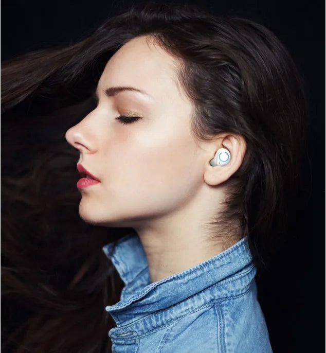 Black and white M18 true wireless Bluetooth earbuds with charging case.