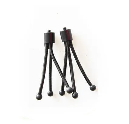 Compact black iron mini tripod with ball head, folded next to an iPhone for scale.